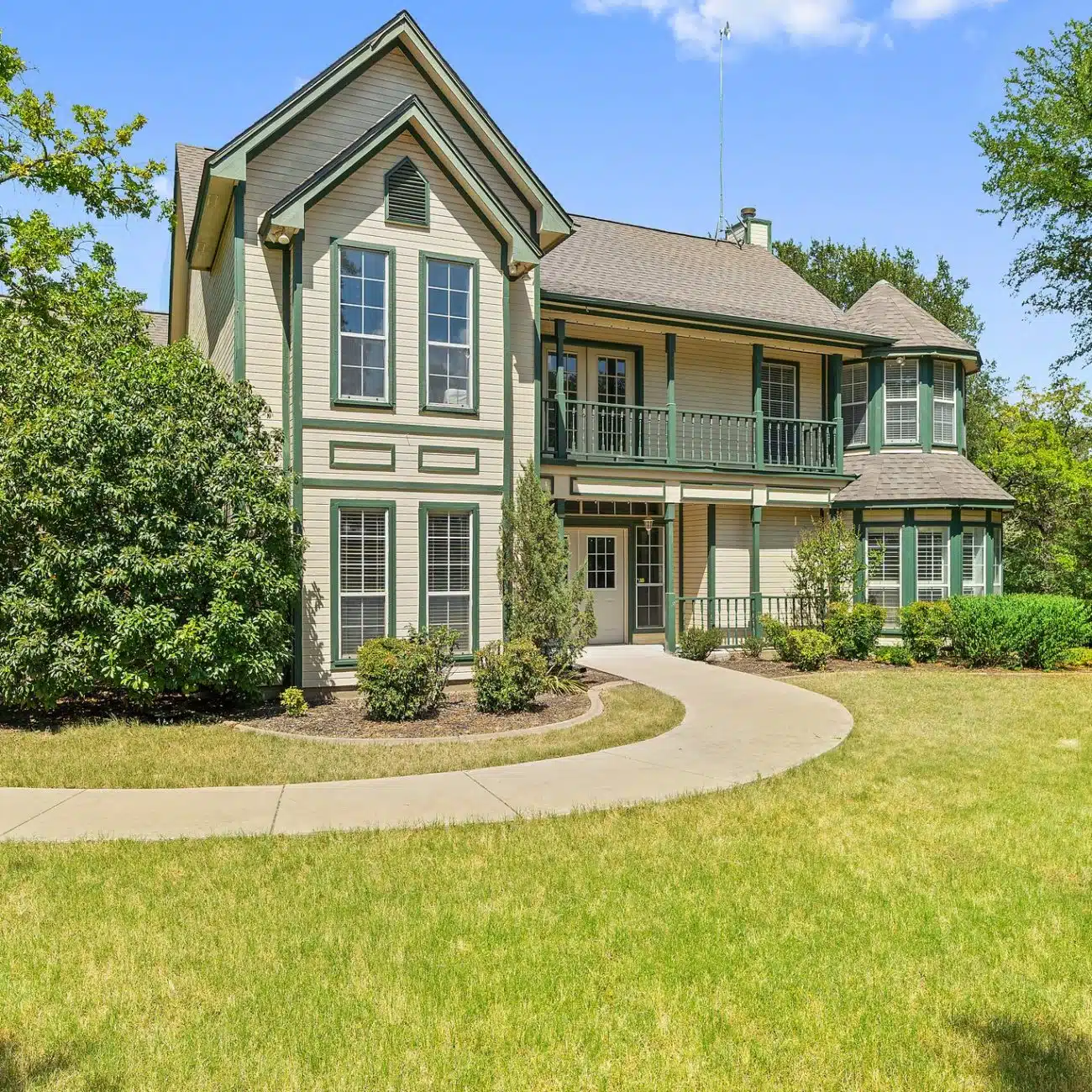 Residential home exterior with landscaped lawn
