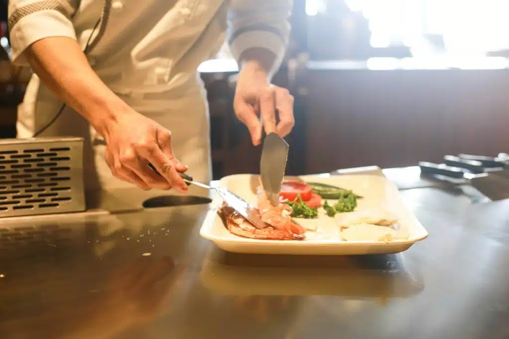 Private chef plating a fresh meal