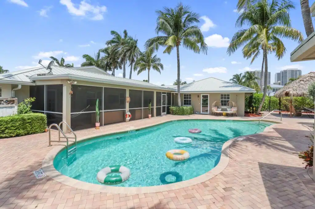 Tropical pool surrounded by palm trees