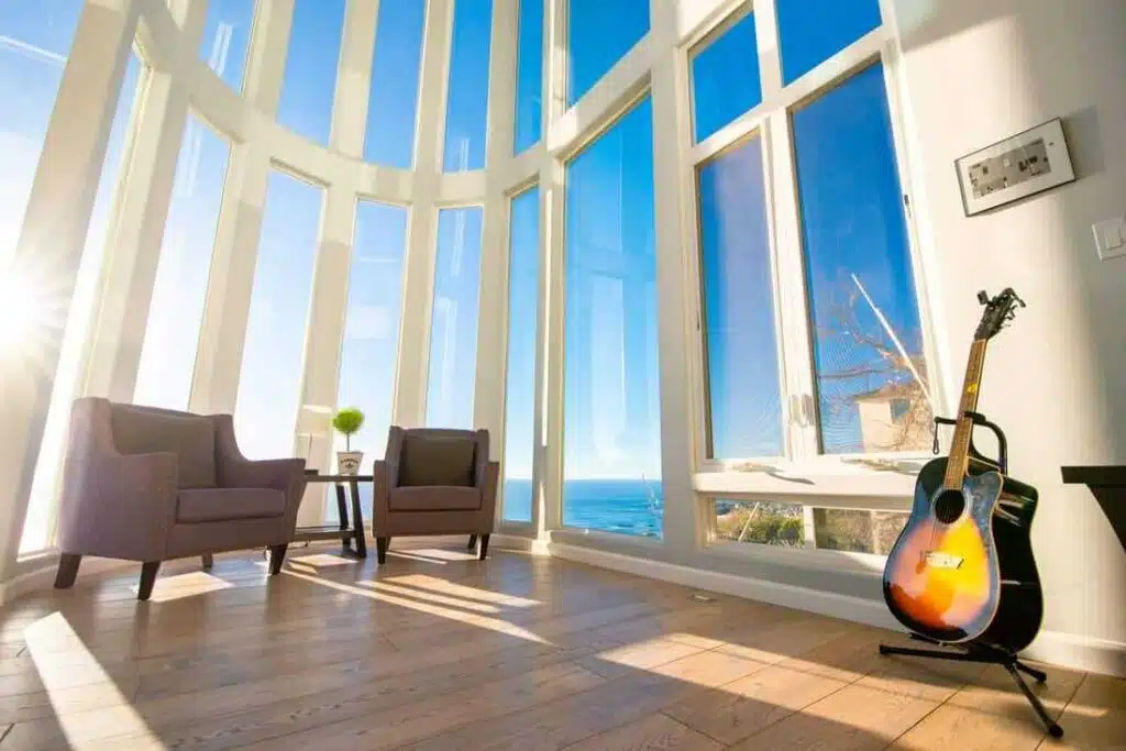 Sunlit sitting room with ocean view